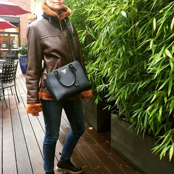 Prada bag and shearling leather jacket